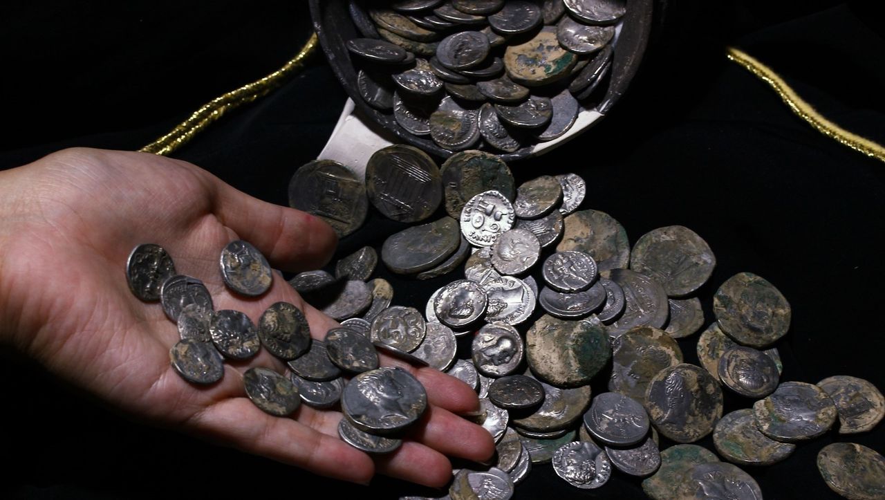 The coins are about 2,100 years old.