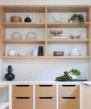 An organic modern kitchen with open wooding shelving