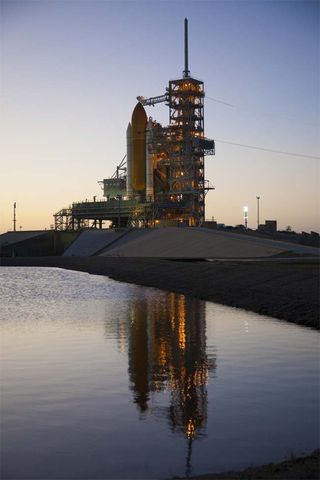 Space Shuttle Launch Delayed by Thick Clouds