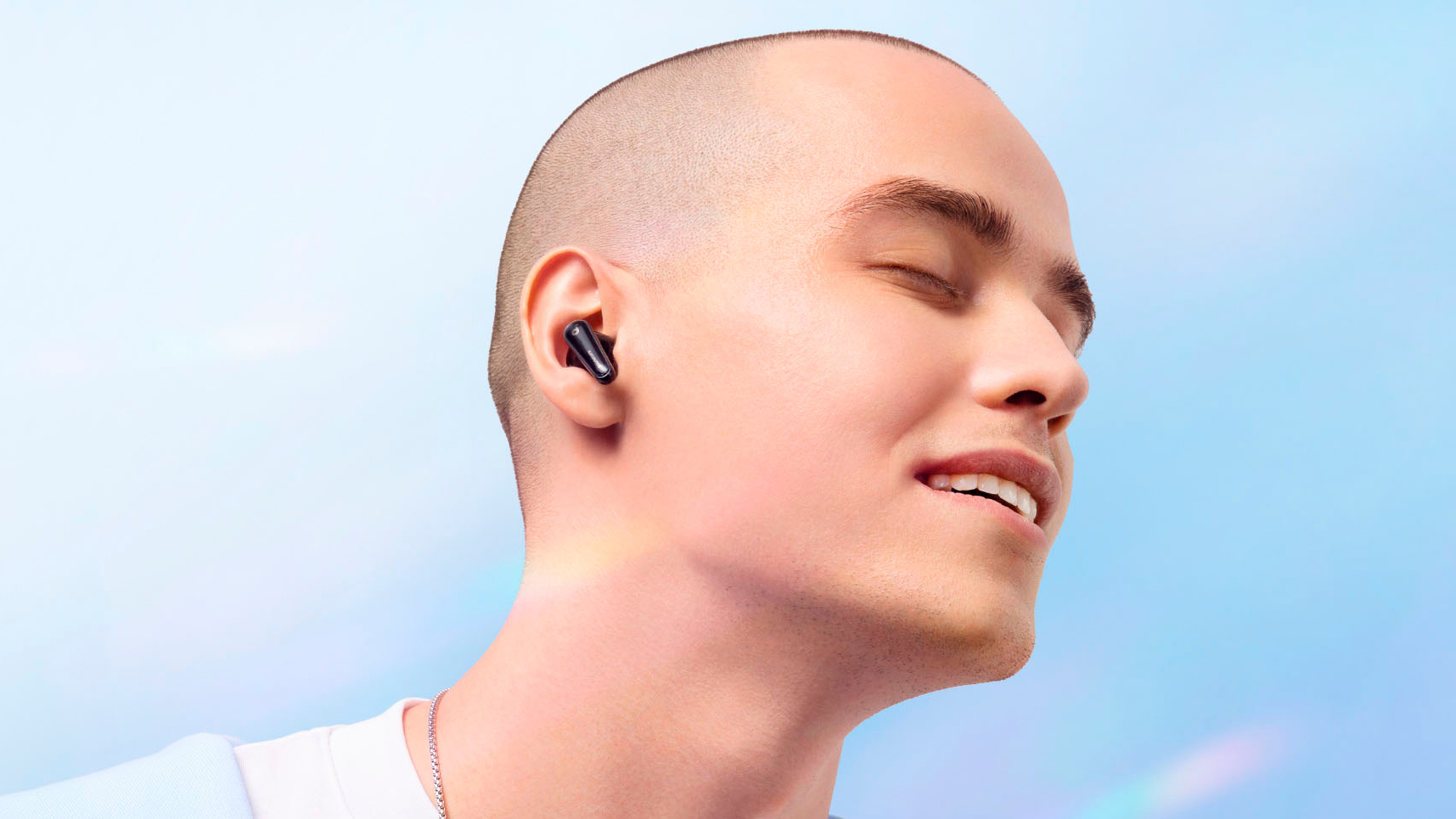 Lifestyle image of man wearing Anker Soundcore Liberty 4 earbuds.