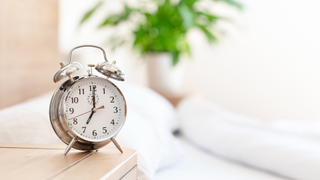 Alarm clock on bedside table