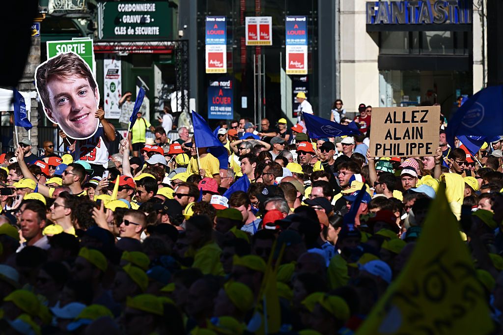 LILLE, FRANCE - JULY 03: Oliver Naesen of Belgium and Team Decathlon AG2R La Mondiale fans during the team presentation prior to the 112th Tour de France 2025 / #UCIWT / on July 03, 2025 in Lille, France. (Photo by Tim de Waele/Getty Images)