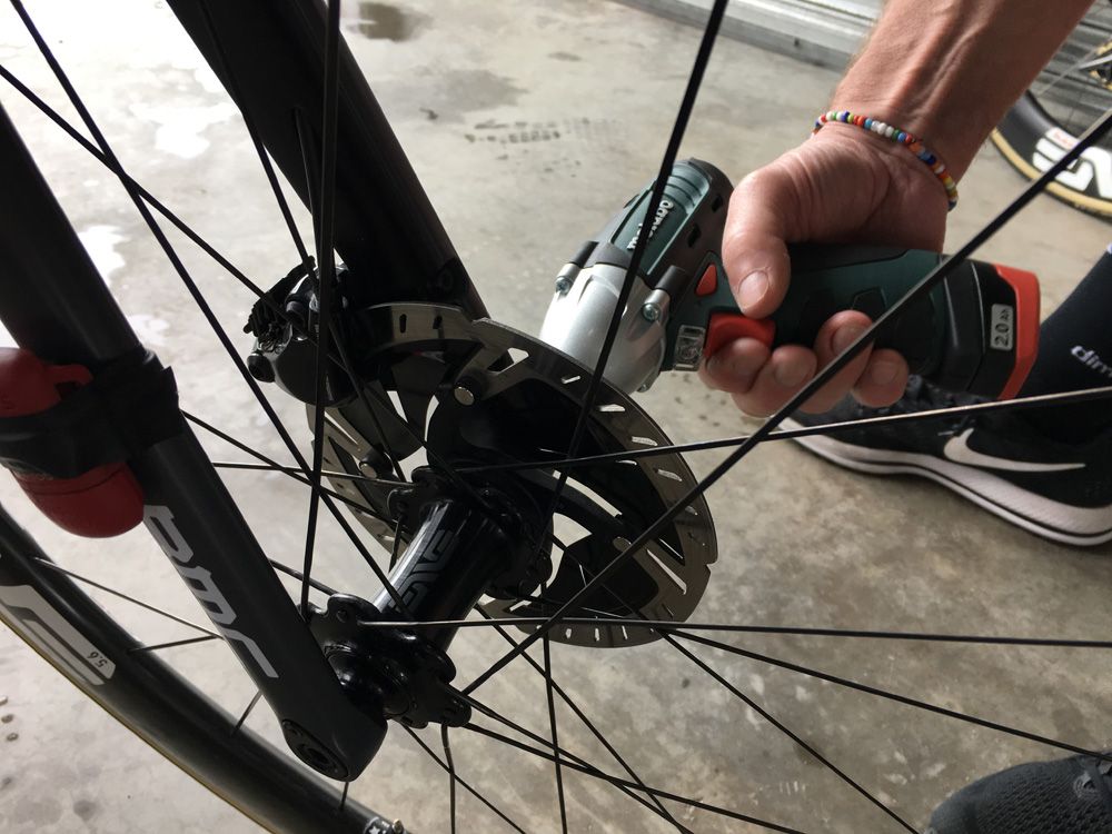 The power tool has torque levels preset to ensure the thru-axle is secure