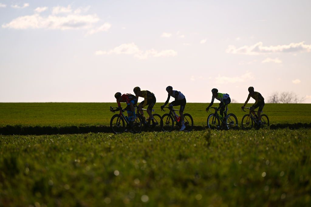 KUURNE BELGIUM FEBRUARY 26 LR Tiesj Benoot of Belgium and Team JumboVisma Tim Wellens of Belgium and UAE Team Emirates and Matej Mohoric of Slovenia and Team Bahrain Victorious compete in the breakaway during the 75th Kuurne Bruxelles Kuurne 2023 a 1931km one day race from Kuurne to Kuurne kuurnebrusselkuurne on February 26 2023 in Kuurne Belgium Photo by Luc ClaessenGetty Images