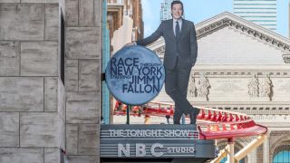 The outdoor marquee to Race Through New York starring Jimmy Fallon, shown during the day.