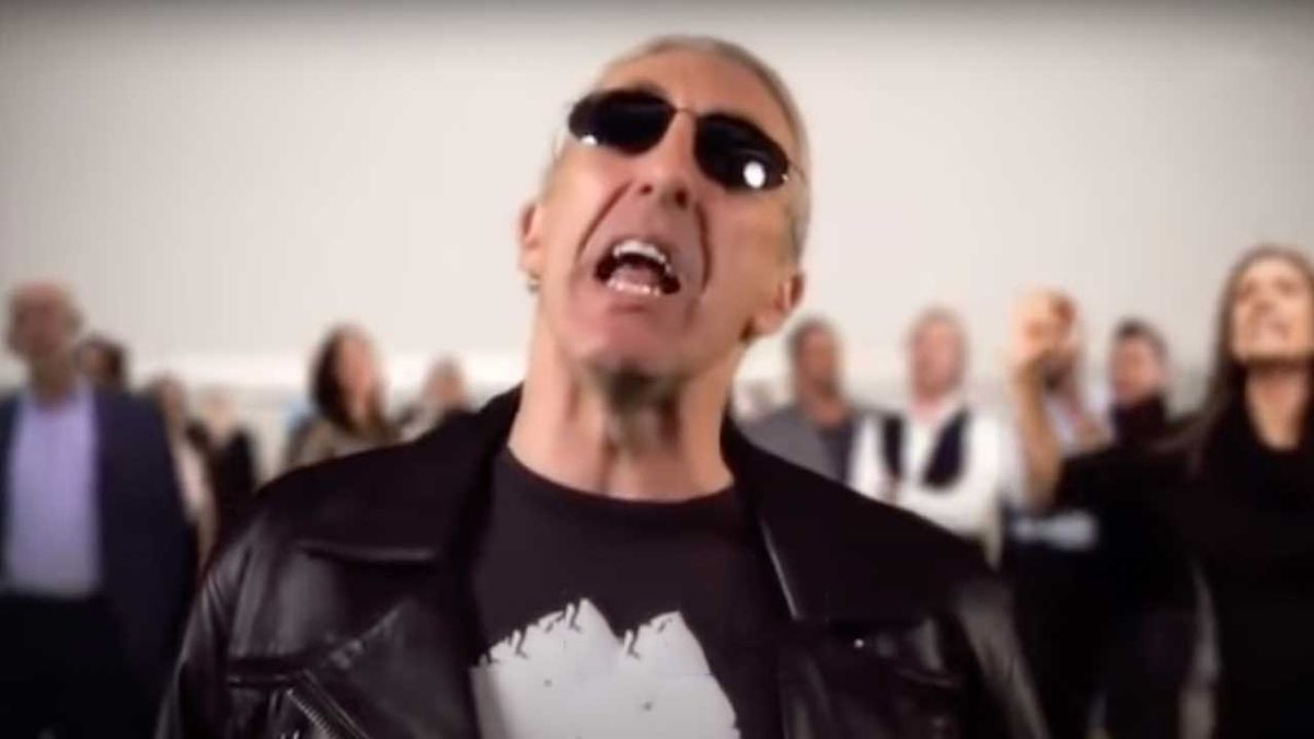 Screengrab of Dee Snider lip-syncing to Let It Be