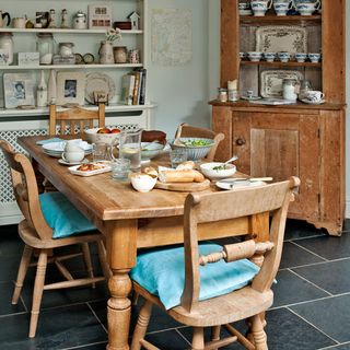 Country kitchen diner with rustic furniture
