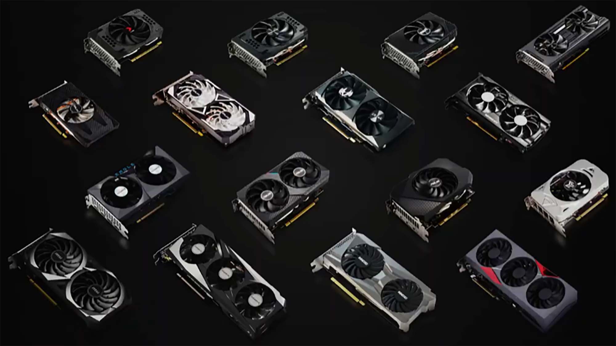 A few dozen RTX 3050 graphics cards spaced out and arranged against a black background