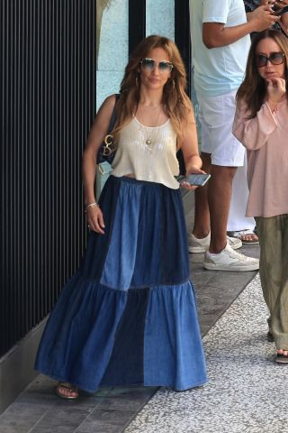 Jennifer Lopez wearing a sequin tank with a patchwork denim Dior skirt in Los Angeles September 2024