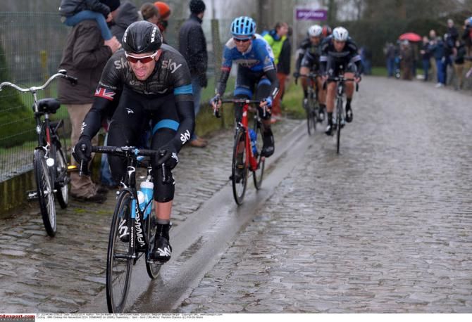 Ian Stannard rides in the gutter with Vansummeren on the back foot