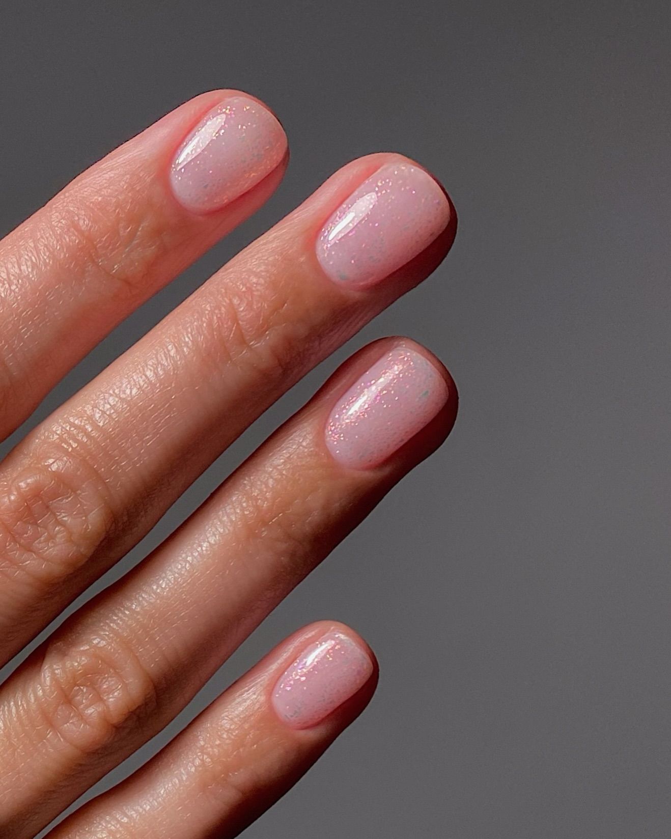 Subtle shimmer engagement nails.