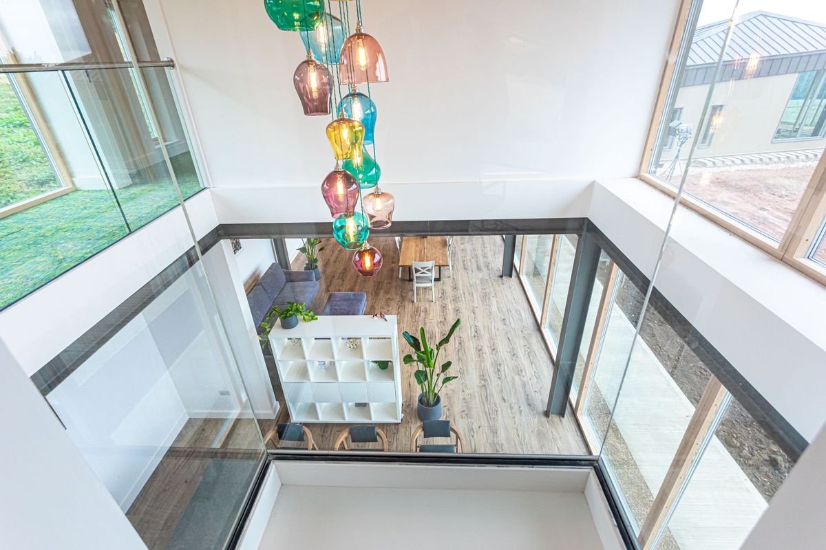 The double-height roof space above the dining area