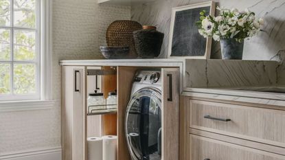 a laundry room with organization ideas next to the washing machine