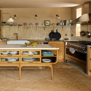 Beige deVOL kitchen with terracotta tiles and wooden kitchen island