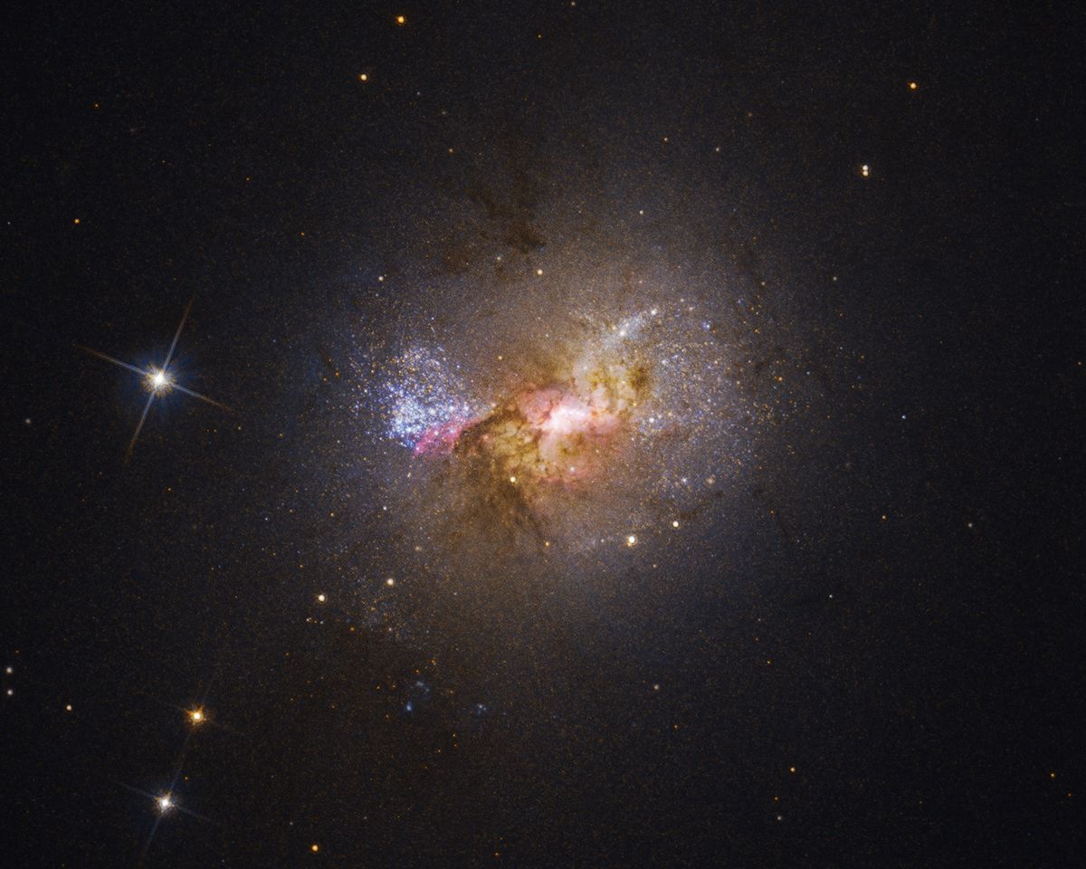 Hubble telescope spots a black hole fostering baby stars in a dwarf galaxy