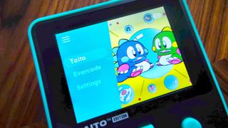 Close up of Super Pocket screen with menu and Bubble Bobble characters