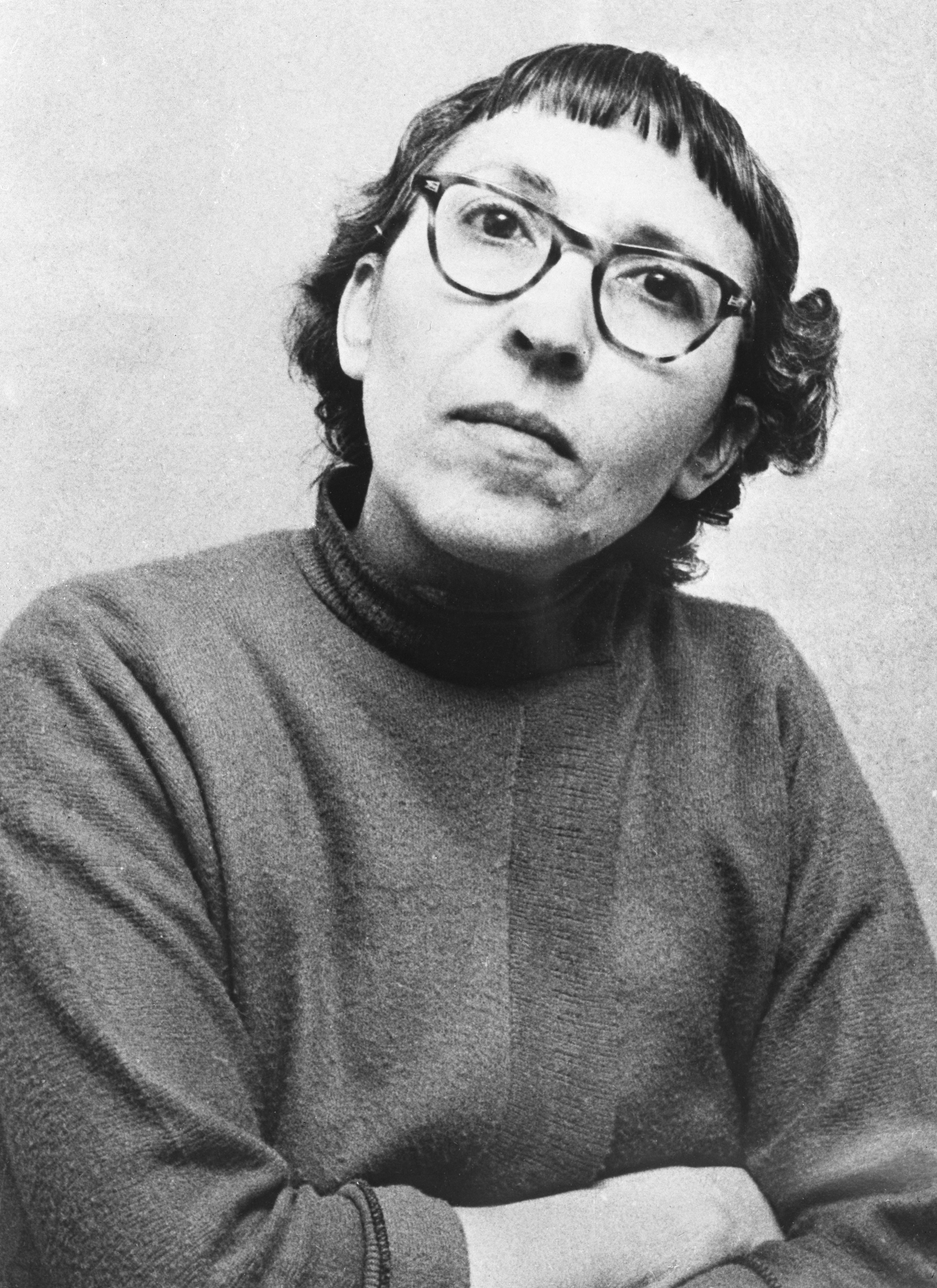 a black and white photo of adeline watkins, the rumored girlfriend of ed gein, wearing a turtle neck sweater