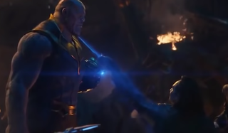 Loki stabs with his left hand