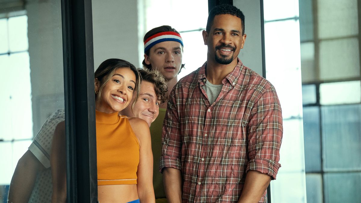 Gina Rodriguez as Mack, Augustus Prew as Brannagan, Joel Courtney as Little and Damon Wayans Jr. as Adam smiling in Players