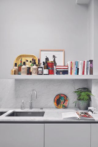 A kitchen with white laminate countertop