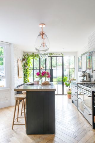 Shoe designer Jacqueline has filled her renovated Edwardianhome with vintage furniture, art, plants and curios from Her travels