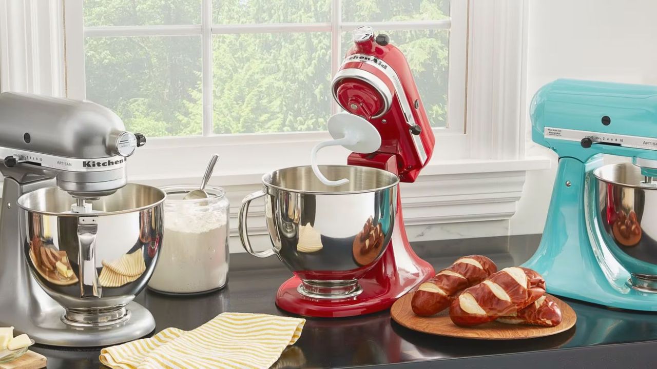 Best KitchenAid deals - three KitchenAid stand mixers on a kitchen counter.