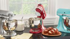 Best Stand Mixer - Three KitchenAid stand mixers on a kitchen counter.