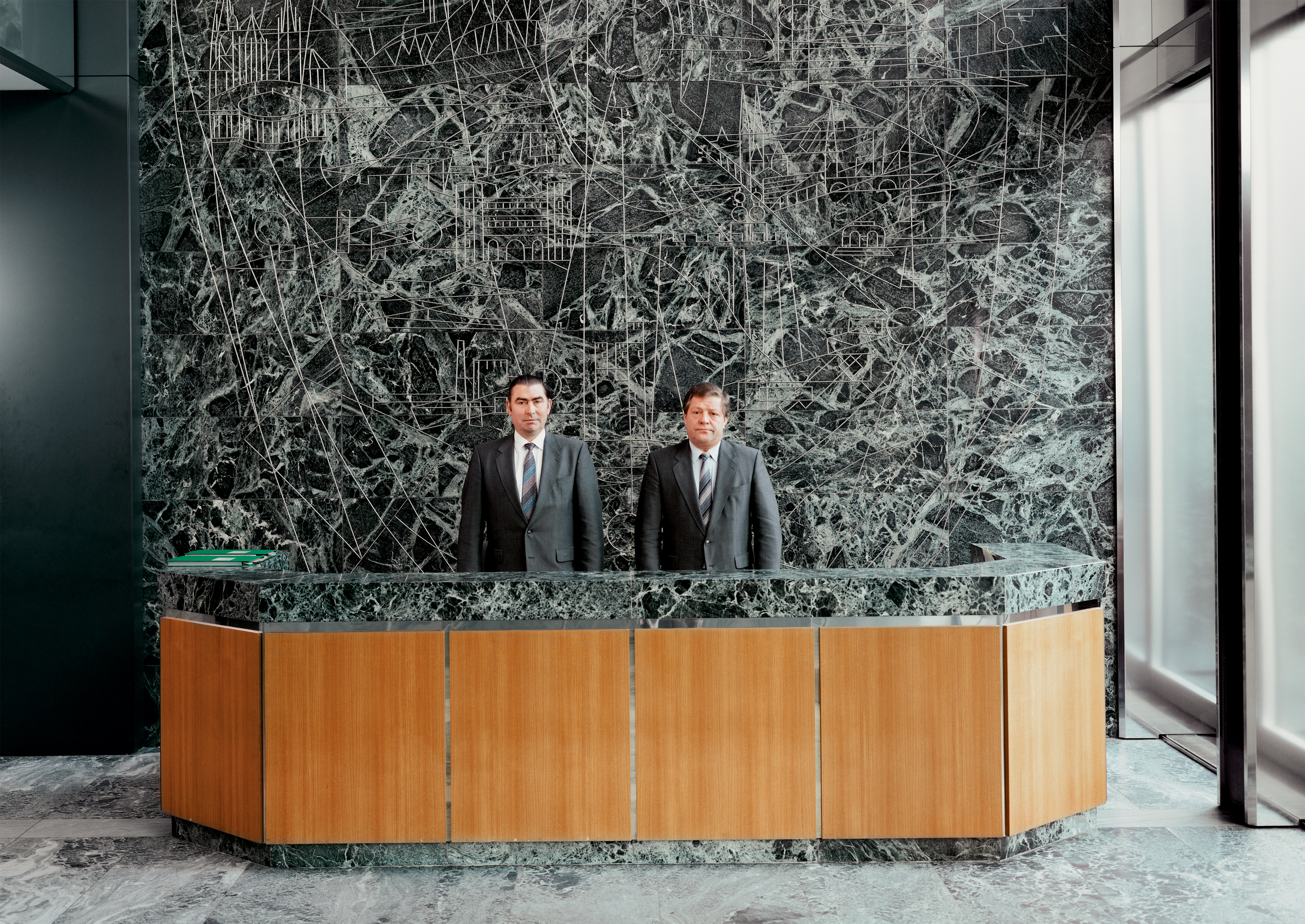 photograph of men behind reception desk, from &amp;lsquo;Seriously&amp;rsquo; at Spr&amp;uuml;th Magers