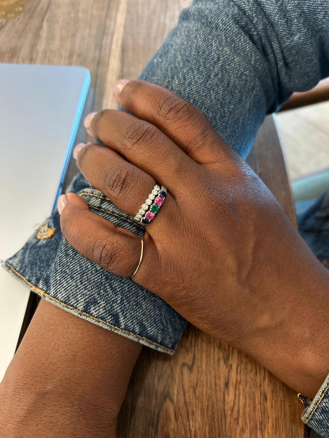 a close up of Lydia Njoh Nseke's engagement ring and wedding band stack