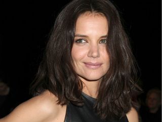 Katie Holmes wears a sexy leather dress at New York Fashion Week.