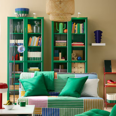 IKEA BILLY bookcase in green in butter yellow living room and geometric bookcase.