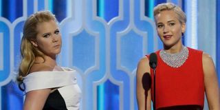 Amy Schumer and Jennifer Lawrence presenting an award
