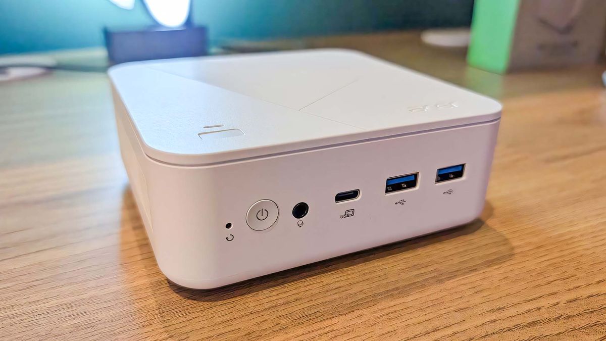 The Acer Revo Box AI on a wooden table.