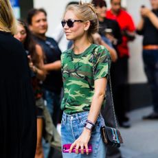 Jessica Minkoff wearing sunglasses and camo print t-shirt