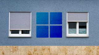 The Windows logo superimposed over a wall with shuttered windows.
