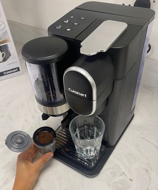 Filling the Cuisinart Grind & Brew Single-Serve Coffee Maker with freshly-ground coffee