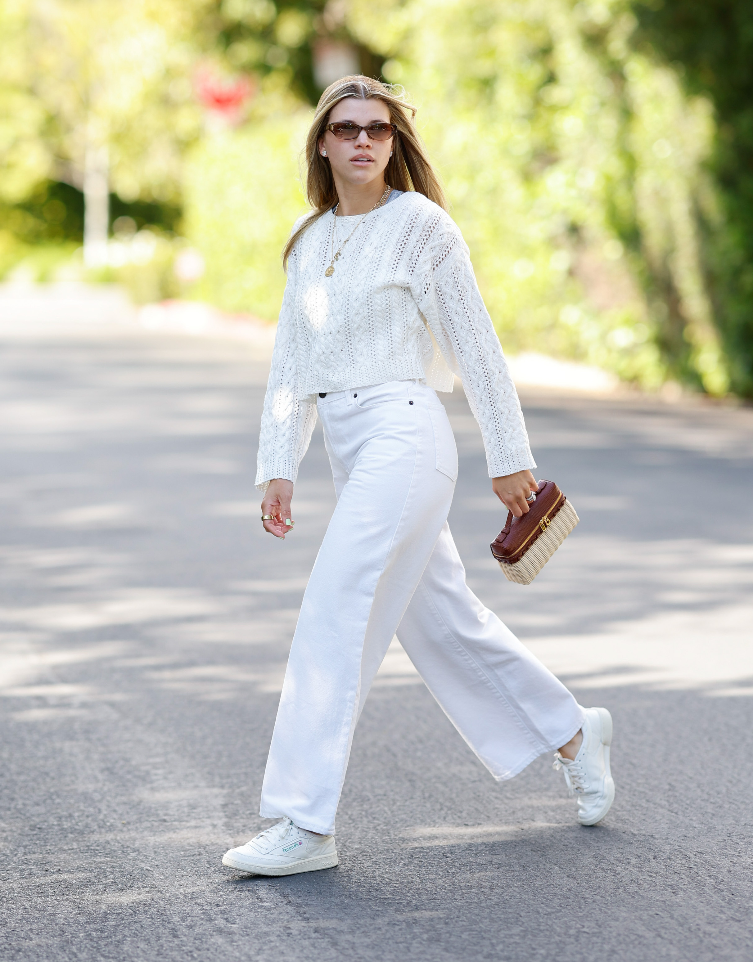 An image of Sofia Richie Grainge in white trainers.