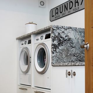 Washing machine and tumble dryer in laundry room