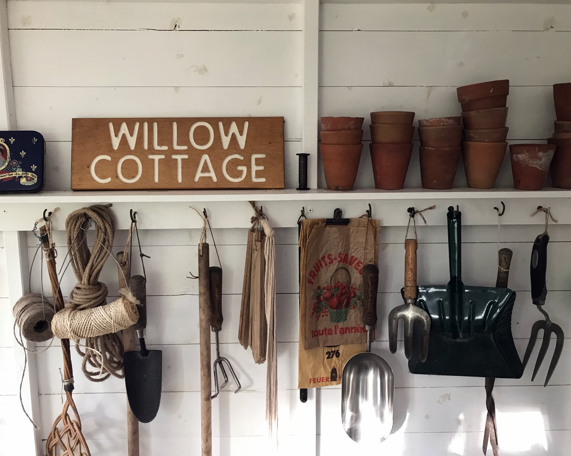 Shelf and hooks in garden shed for storage