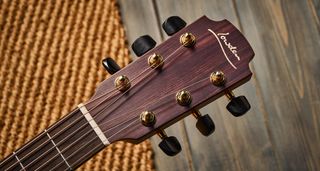 The headstock of the Lowden F-12 Spruce Top acoustic guitar