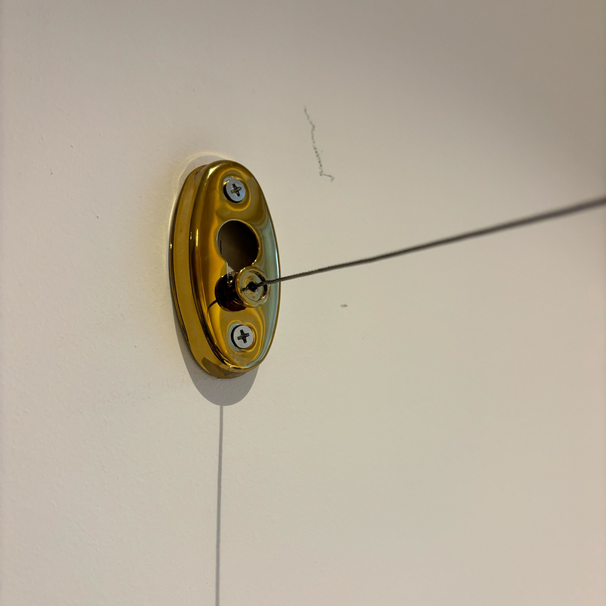 brass retractable clothes line in its lock