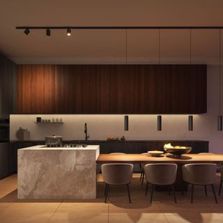 a neutral kitchen with dimmed recessed and overhead lighting
