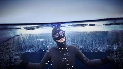 Goggles, Personal protective equipment, Diving equipment, Cool, Underwater, Flash photography, Underwater diving, Water sport, Costume, Wetsuit, 