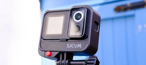 A photo of the SJCAM Sj20 being held up with the lenses showing against a blue backdrop.