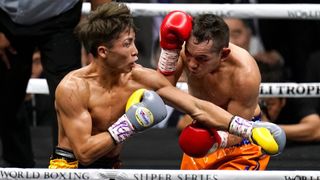 Naoya Inoue (L) of Japan and Nonito Donaire (R) of the Philippines exchange punches in their first fight