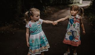 2 children holding hands