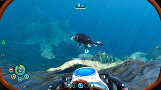 A screenshot from Subnautica Below Zero, showing the player swimming with an underwater scooter while observing a fish