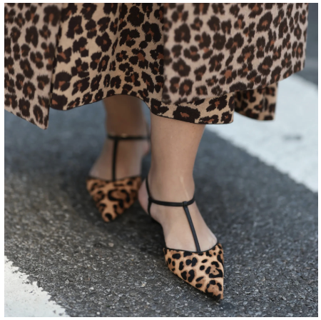 woman wearing leopard print shoes