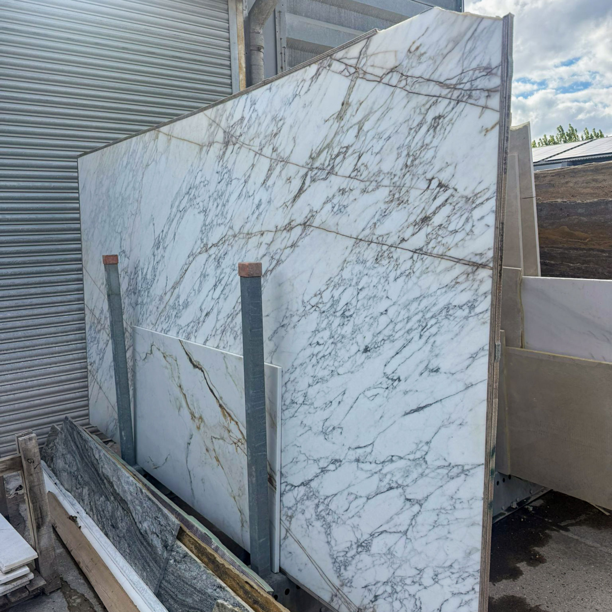Large slab of white marble in warehouse yard