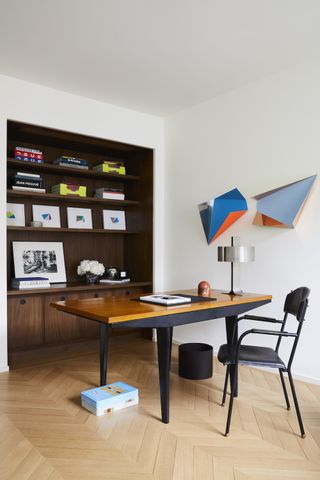 A home office with a statement piece of wall art